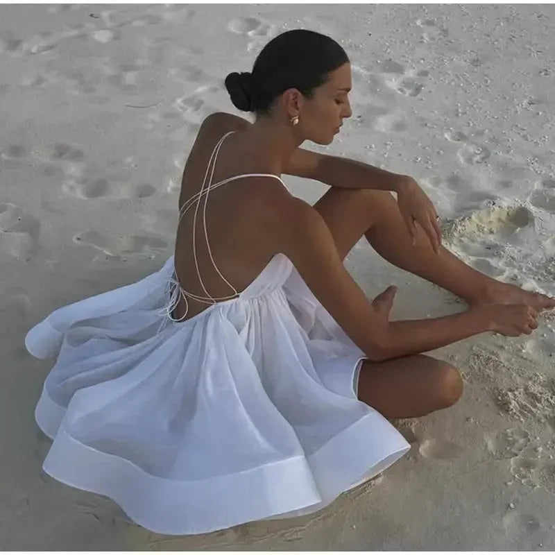 Robe de plage courte bouffante dos nu pour femme, tenue sexy à lacets, sans manches, coupe trapèze, couleur unie, idéale pour les vacances en bord de mer, été 2025
