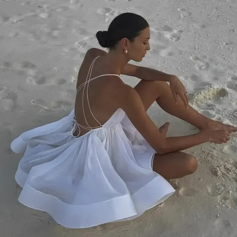 Robe de plage courte bouffante dos nu pour femme, tenue sexy à lacets, sans manches, coupe trapèze, couleur unie, idéale pour les vacances en bord de mer, été 2025