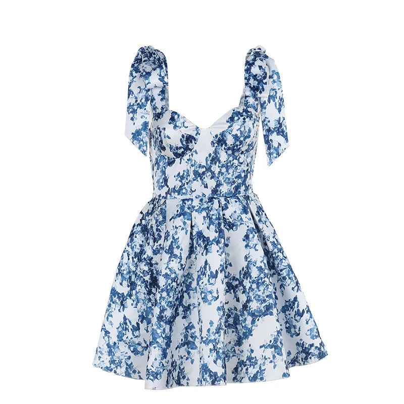 Imprimé floral de vacances d'été ; mignon et élégant ; mini robe trapèze à épaules dénudées ; mode nouée ; robe de soirée pour femme.